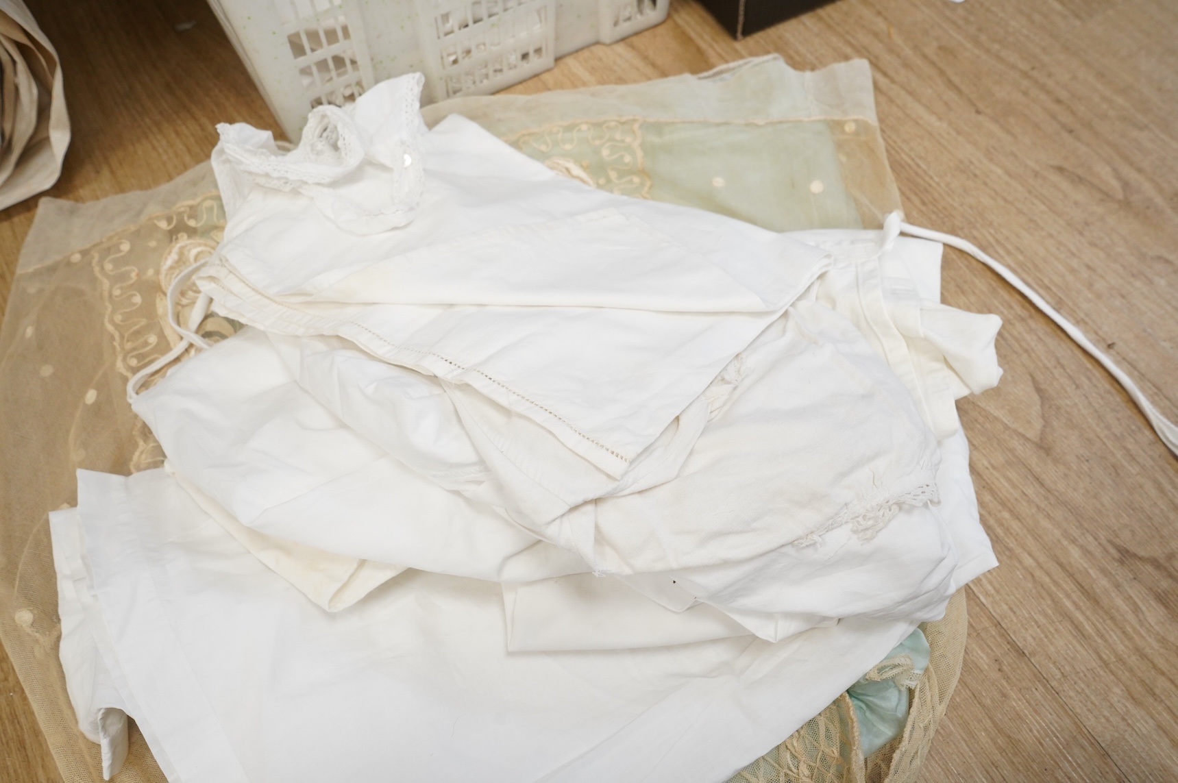 A collection of French mixed chemise and under garments and lace child’s dress